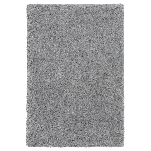 A grey shaggy area rug named VOLLERSLEV, made from recycled polyester and polypropylene, rectangular and soft-textured.