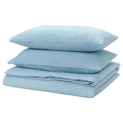 A stack of three blue and white chequered pillows, square in shape, with a folded chequered sheet on top.