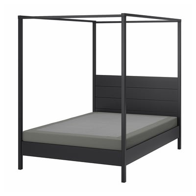 Modern black metal four-poster bed with grey mattress, sleek, minimalist design.