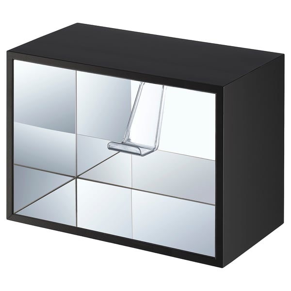 The YXSTABY, a sleek black cube-shaped shelf with mirror sides and clear plastic handles.