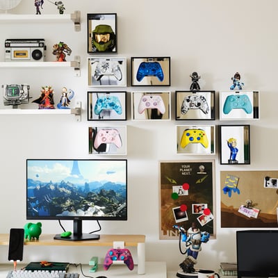The YXSTABY, a sleek black cube-shaped shelf with mirror sides and clear plastic handles.