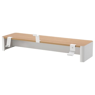 The YXSTABY shelf is light brown with white metal brackets. Its rectangular, simple, and modern.
